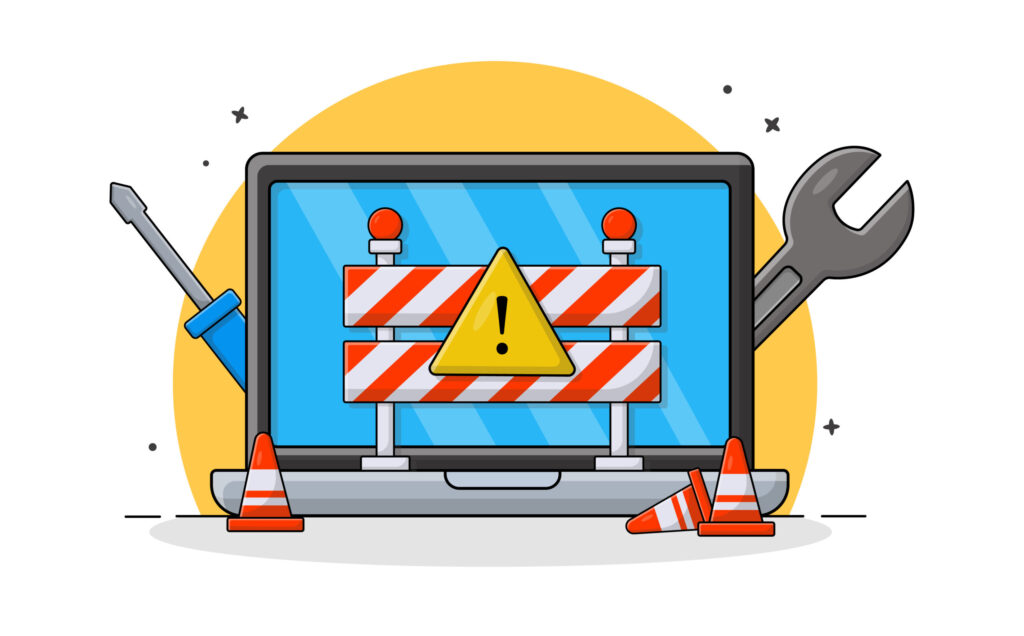 Laptop con schermata di manutenzione: segnali di blocco, cacciavite e chiave inglese.